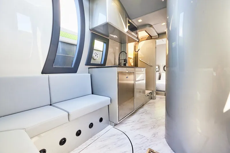 Slide: The Image of Luxurious interior of Midnight Express 52' Vitesse yacht with modern kitchen and seating area. - 21