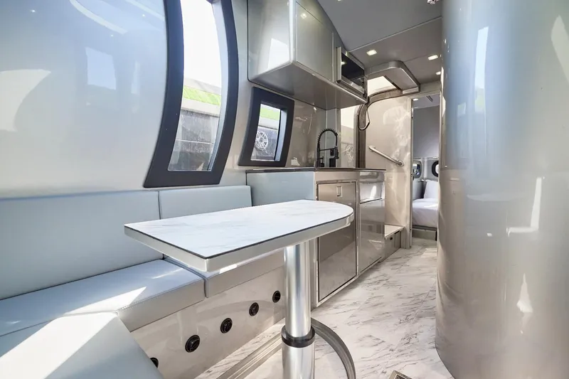 Slide: The Image of Luxurious interior of Midnight Express 52' Vitesse yacht with modern kitchen and seating area. - 22