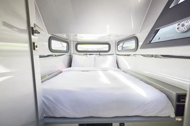 Slide: The Image of Luxurious cabin interior of Midnight Express 52' Vitesse yacht with a comfortable bed. - 23