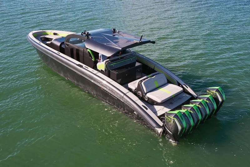 Slide: The Image of Midnight Express 52' Vitesse luxury boat with multiple outboard engines on water. - 3