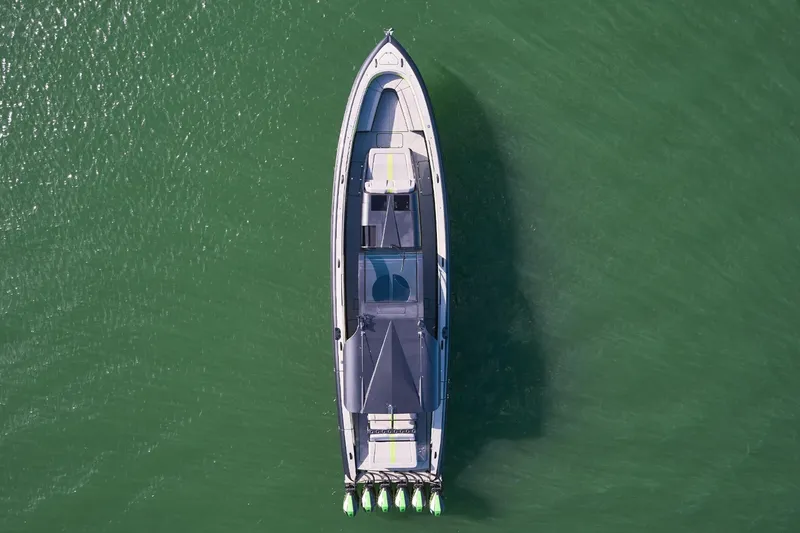 Slide: The Image of Aerial view of Midnight Express 52' Vitesse boat on green water. - 6