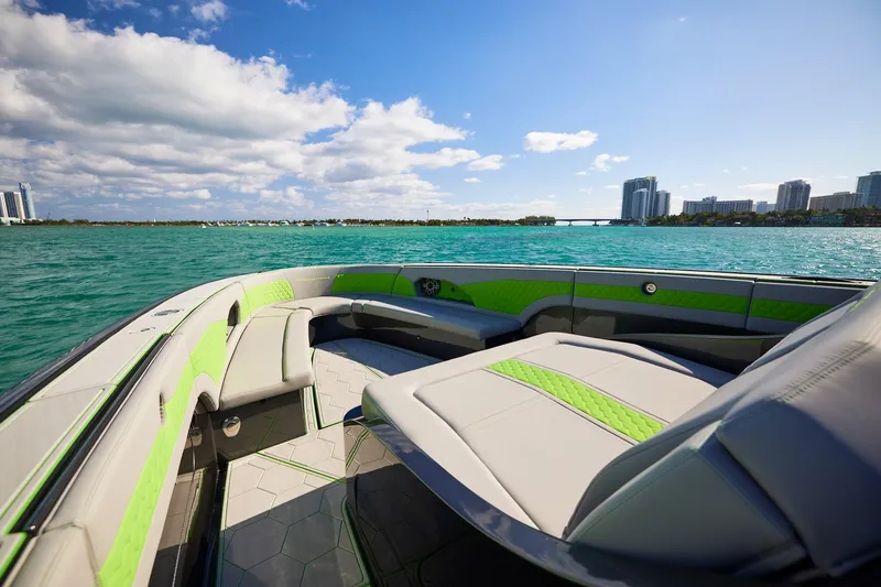 Slide: The Image of Luxurious Midnight Express 52' Vitesse boat interior with green accents on a sunny day. - 9