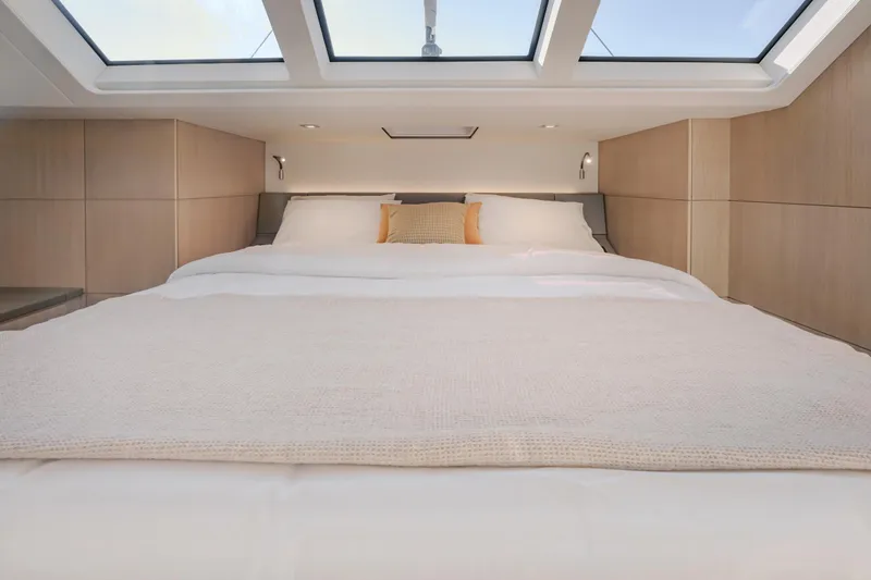 Slide: The Image of Luxurious bedroom interior of 2025 Privilege Signature 650 yacht with skylights and modern design. - 30