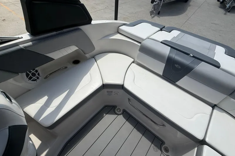 Slide: The Image of 2021 Chaparral 230 SSi boat interior with white seating and modern design. - 14