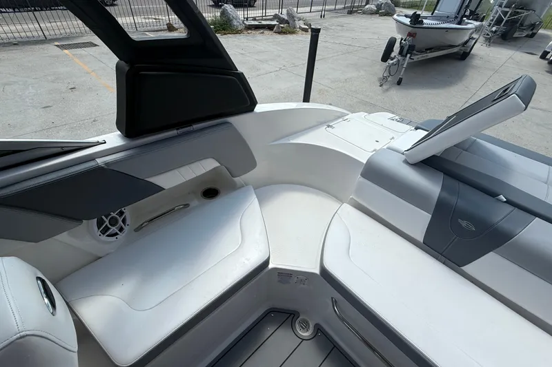 Slide: The Image of 2021 Chaparral 230 SSi boat interior with white seating and modern design. - 15