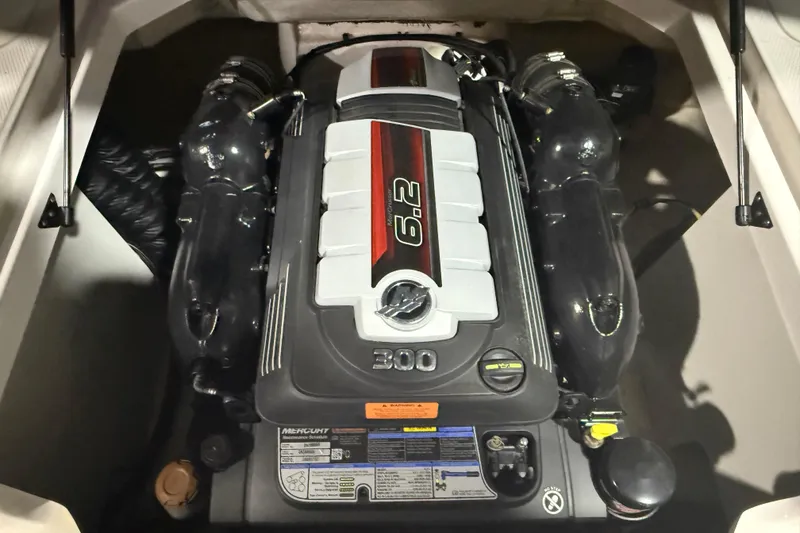 Slide: The Image of Engine compartment of a 2021 Chaparral 230 SSi boat, featuring a 6.2-liter engine. - 19