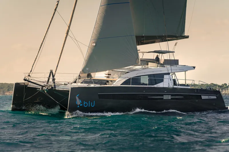 Slide: The Image of Luxury Privilege Signature 650 catamaran sailing on open water, 2025 model. - 5