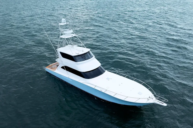Slide: The Image of 2009 Viking 74 Enclosed Bridge yacht on open water, aerial view. - 16