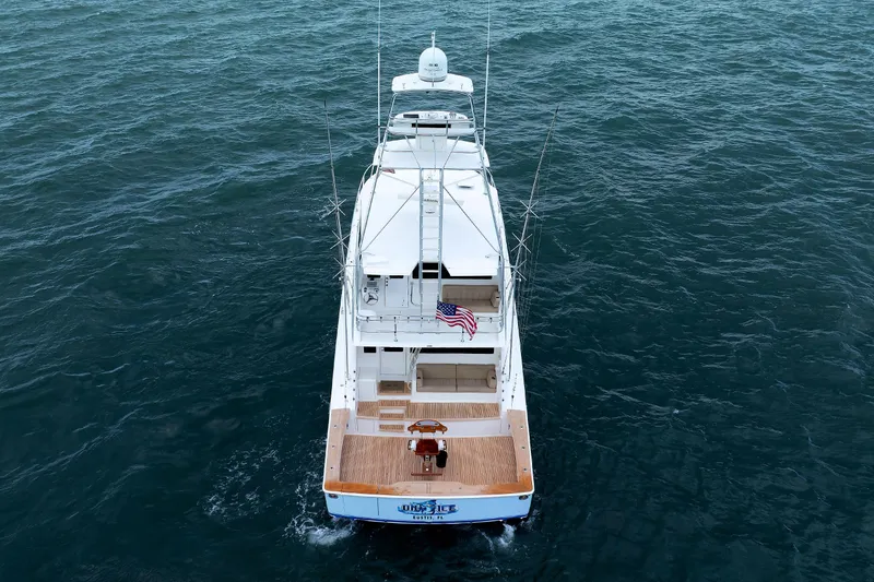 Slide: The Image of Aerial view of 2009 Viking 74 Enclosed Bridge yacht cruising on open water. - 18
