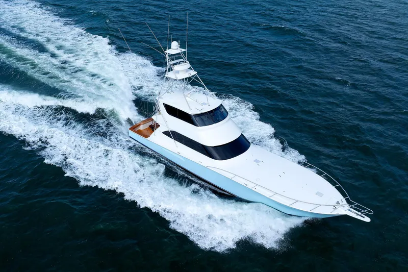 Slide: The Image of 2009 Viking 74 Enclosed Bridge yacht cruising on open water. - 42