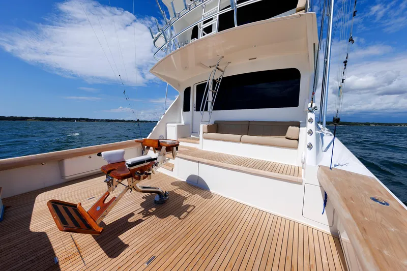 Slide: The Image of 2009 Viking 74 Enclosed Bridge yacht with spacious deck and fishing chair. - 44