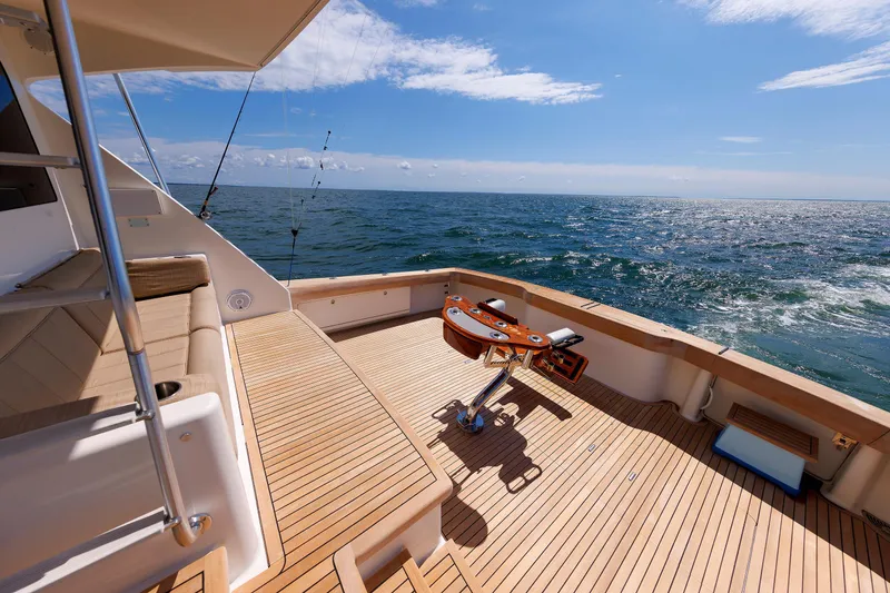Slide: The Image of Luxurious 2009 Viking 74 Enclosed Bridge yacht deck with ocean view. - 52
