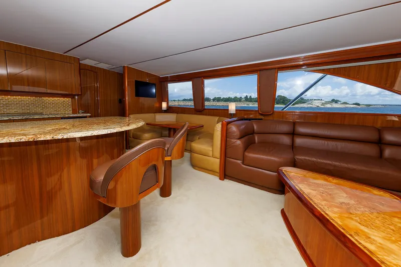 Slide: The Image of Luxurious interior of 2009 Viking 74 Enclosed Bridge yacht with elegant wood finishes and ocean view. - 60