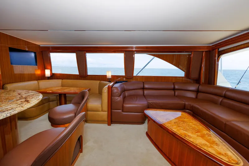 Slide: The Image of Luxurious interior of 2009 Viking 74 Enclosed Bridge yacht with leather seating and ocean view. - 61