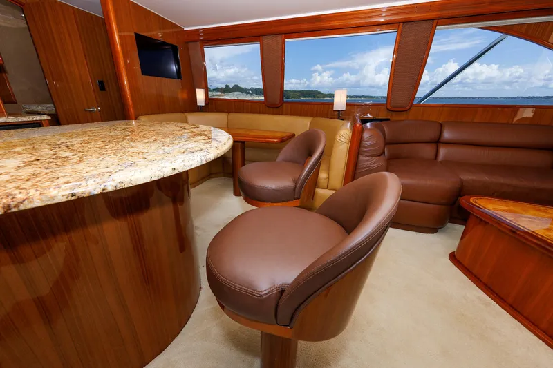 Slide: The Image of Luxurious interior of 2009 Viking 74 Enclosed Bridge yacht with leather seating and granite countertops. - 71
