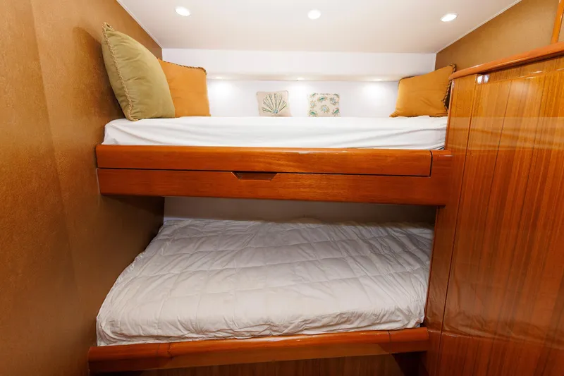 Slide: The Image of Bunk beds in 2009 Viking 74 Enclosed Bridge yacht cabin with wooden finish. - 88