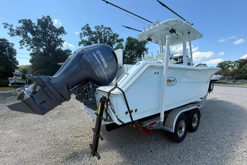 Slide: The Image of 2015 Sea Hunt Gamefish 27 boat on trailer with Yamaha outboard motor. - 10