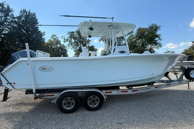 Slide: The Image of 2015 Sea Hunt Gamefish 27 boat on trailer, side view, outdoors. - 11