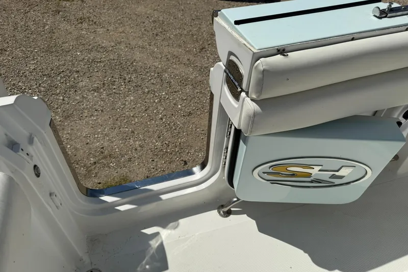 Slide: The Image of 2015 Sea Hunt Gamefish 27 boat interior with SH logo and seating detail. - 13