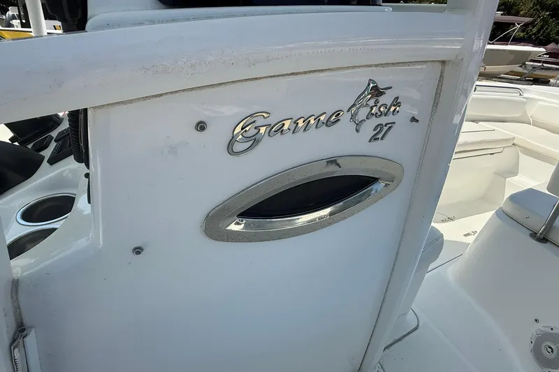 Slide: The Image of 2015 Sea Hunt Gamefish 27 boat interior with logo detail. - 17