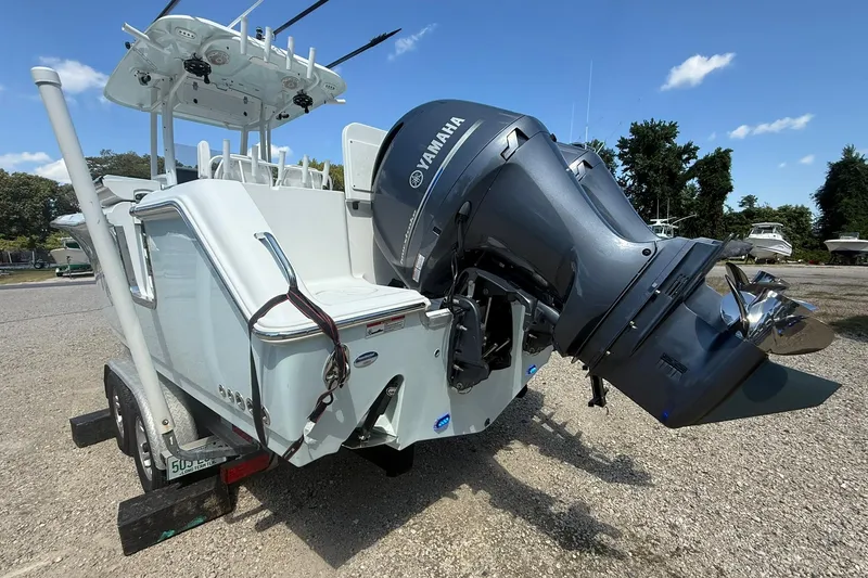 Slide: The Image of 2015 Sea Hunt Gamefish 27 boat with Yamaha outboard motor on a trailer. - 8