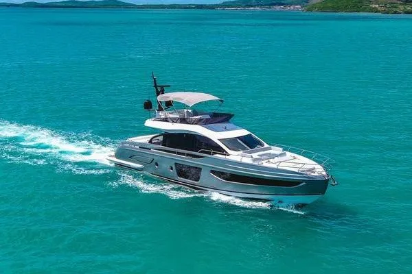 The Image of 2024 Azimut S7 yacht cruising on turquoise waters under clear skies. - 0