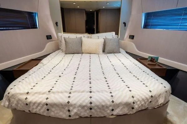 Slide: The Image of Luxurious bedroom interior of 2024 Azimut S7 yacht with elegant bedding and modern design. - 14
