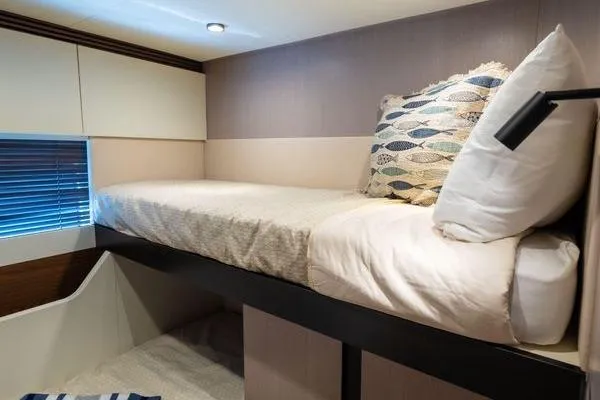 Slide: The Image of Luxurious 2024 Azimut S7 yacht cabin with cozy bed and modern decor. - 18