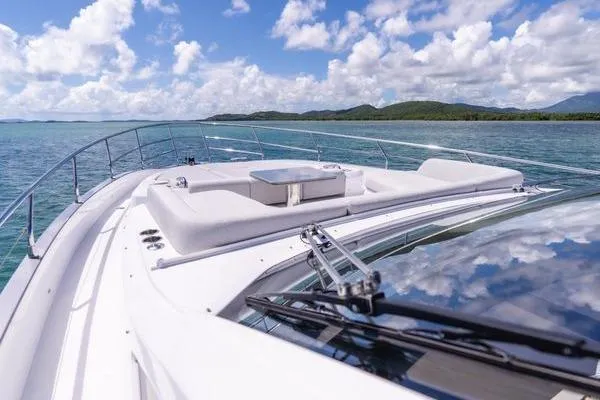 Slide: The Image of 2024 Azimut S7 yacht cruising on clear blue waters under a bright sky. - 19