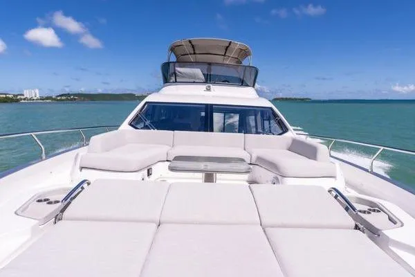 Slide: The Image of 2024 Azimut S7 yacht with luxurious deck seating on open water. - 20