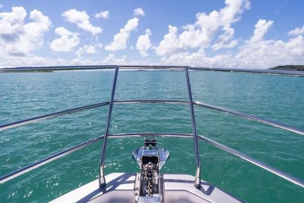 Slide: The Image of Bow view from 2024 Azimut S7 yacht on open sea under blue sky. - 21