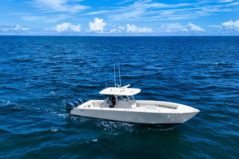 Slide: The Image of 2018 Jupiter 38 FS boat cruising on open ocean under clear blue sky. - 11