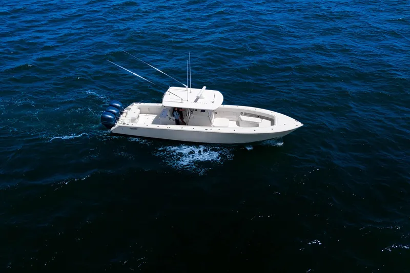 Slide: The Image of 2018 Jupiter 38 FS boat cruising on open blue water. - 13