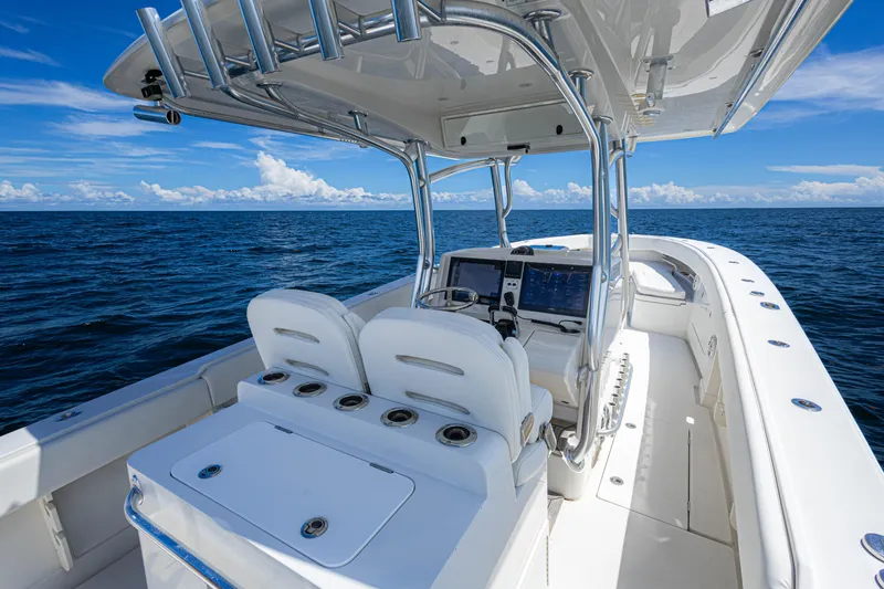 Slide: The Image of 2018 Jupiter 38 FS boat on open sea, featuring sleek design and modern navigation equipment. - 23