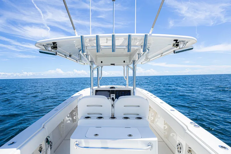 Slide: The Image of 2018 Jupiter 38 FS boat on open ocean under clear blue sky. - 24