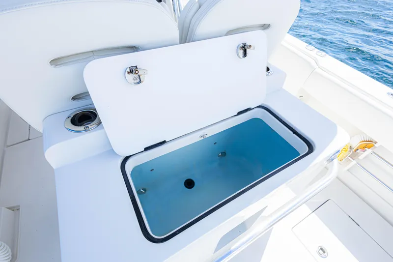 Slide: The Image of Open storage compartment on 2018 Jupiter 38 FS boat, with ocean in background. - 27