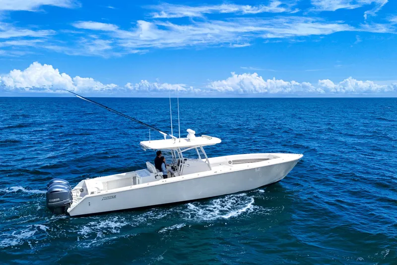 Slide: The Image of 2018 Jupiter 38 FS boat cruising on open ocean under clear blue sky. - 3