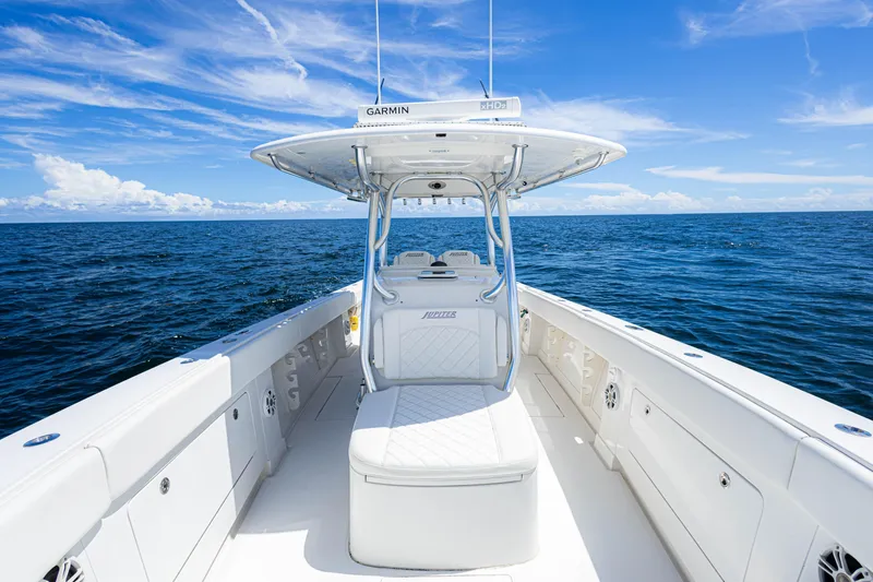 Slide: The Image of 2018 Jupiter 38 FS boat on open ocean under clear blue sky. - 30
