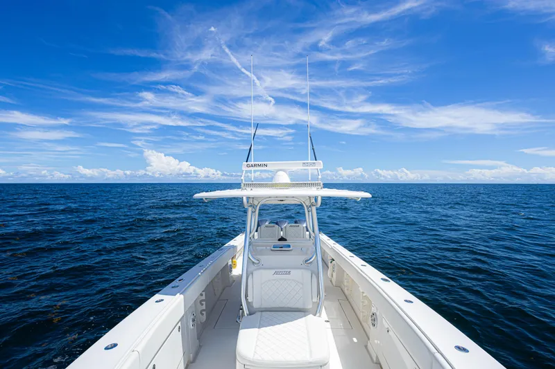 Slide: The Image of 2018 Jupiter 38 FS boat on open ocean under clear blue sky. - 31