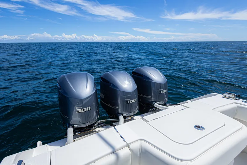 Slide: The Image of 2018 Jupiter 38 FS boat with triple Yamaha 300 engines on open sea. - 33