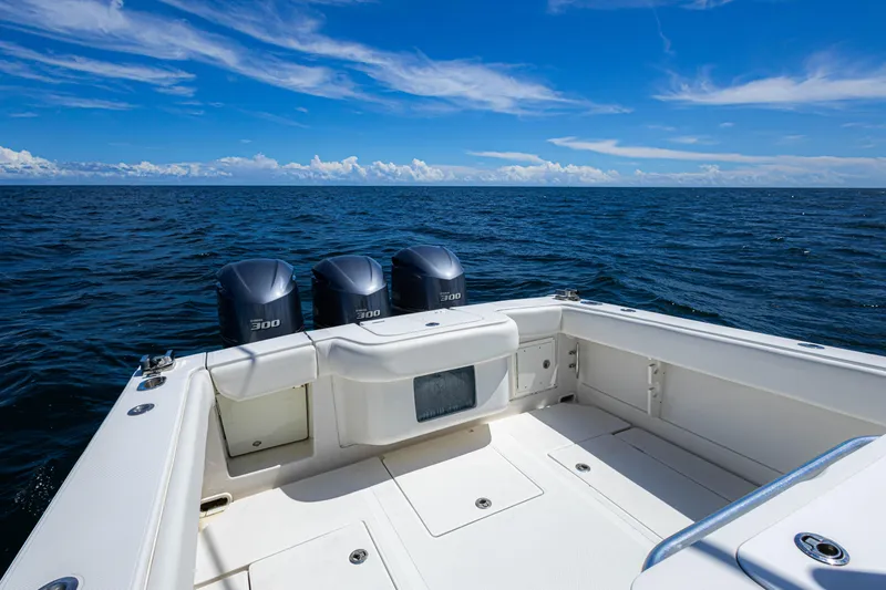 Slide: The Image of 2018 Jupiter 38 FS boat with triple 300 horsepower engines on open sea. - 35