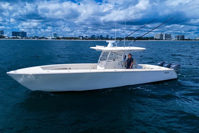 Slide: The Image of 2018 Jupiter 38 FS boat cruising on open water under a cloudy sky. - 4