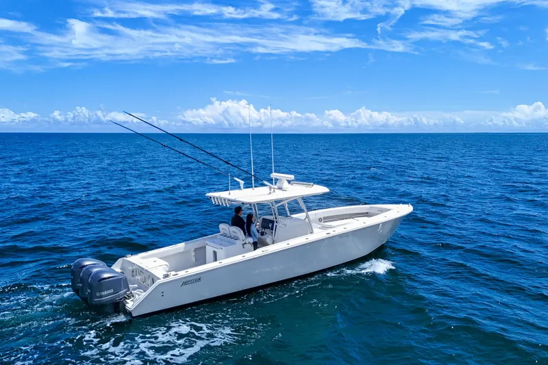 Slide: The Image of 2018 Jupiter 38 FS boat cruising on open ocean under clear blue sky. - 6