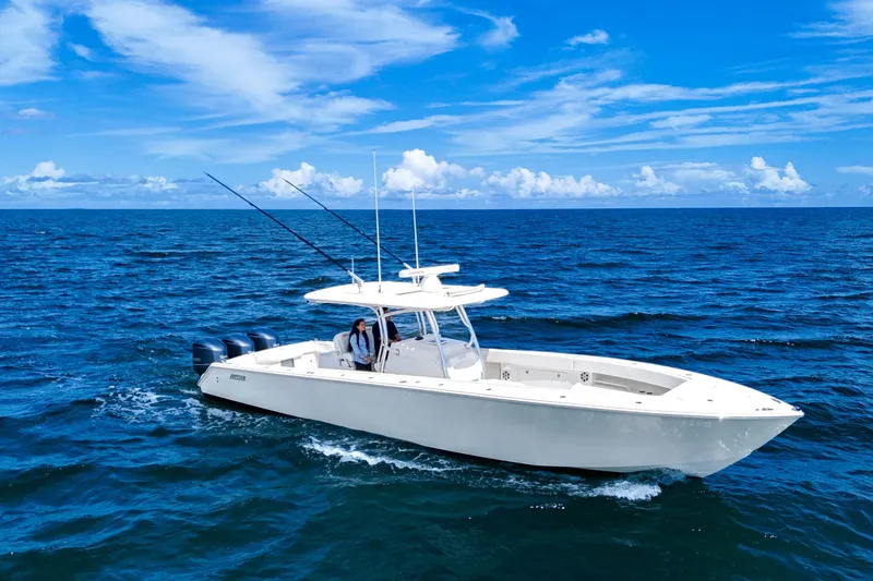 Slide: The Image of 2018 Jupiter 38 FS boat cruising on open ocean under clear blue sky. - 7