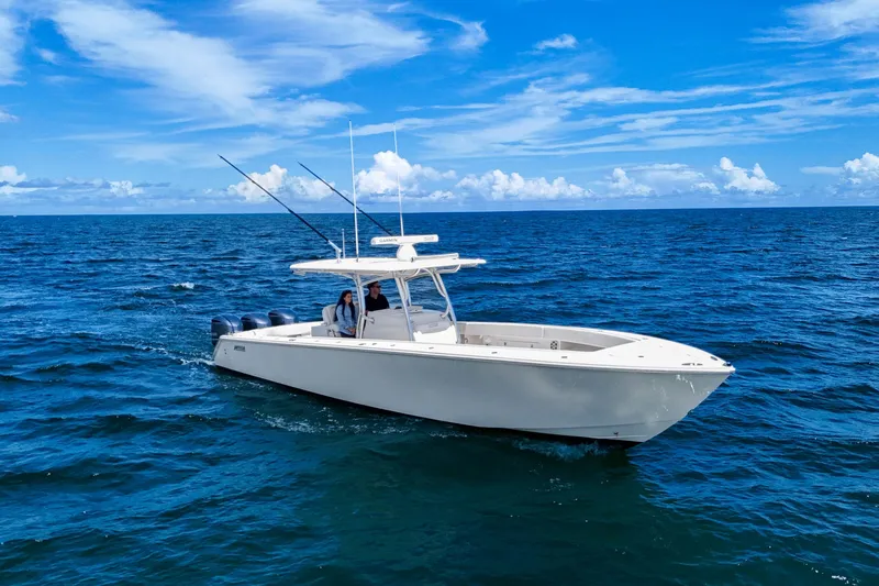 Slide: The Image of 2018 Jupiter 38 FS boat cruising on open ocean under clear blue sky. - 8