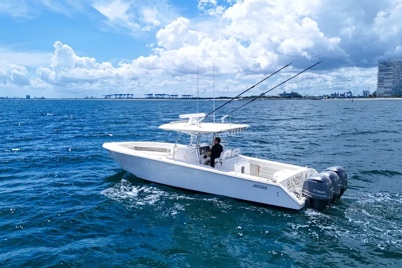 Slide: The Image of 2018 Jupiter 38 FS boat cruising on open ocean under a partly cloudy sky. - 9