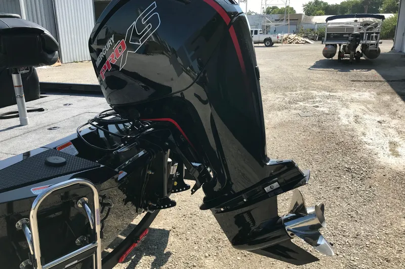 Slide: The Image of 2026 Ranger RT188P boat with outboard motor on a trailer, industrial background. - 4