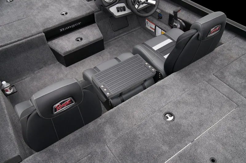 Slide: The Image of Manufacturer Provided Image: 2025 Ranger RT188P boat interior with fishing rods and drink holder. - 57