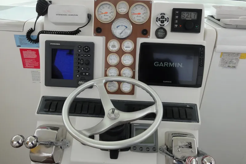Slide: The Image of Control panel of a 2002 Rampage 30 Open boat with Garmin and Furuno displays. - 15