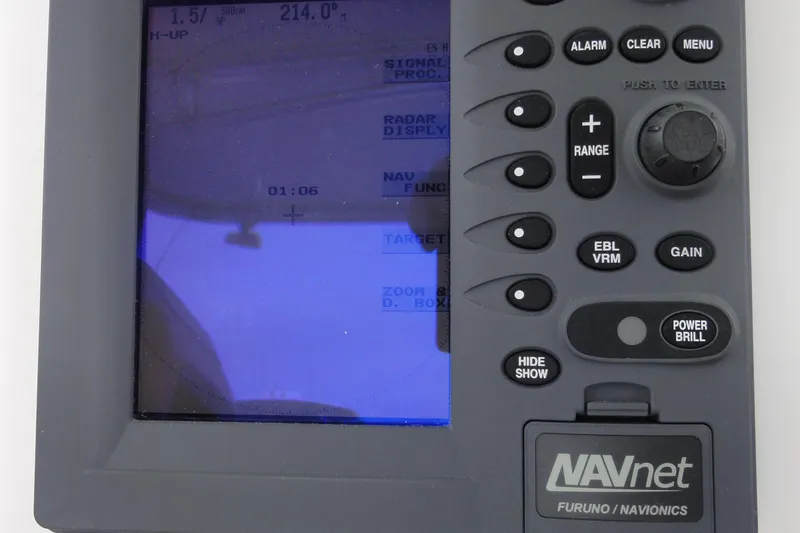 Slide: The Image of NAVnet marine navigation system on 2002 Rampage 30 Open boat, displaying radar and control buttons. - 18